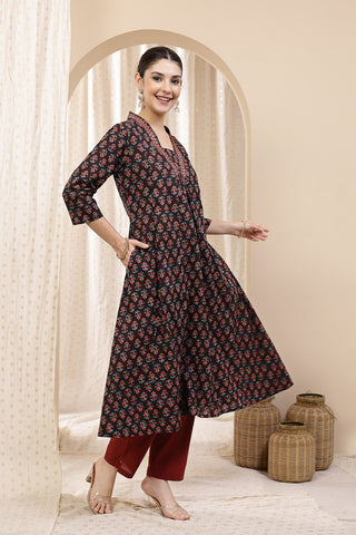 Model action shot of the Embroidered Floral Cotton Kurta Set, demonstrating ease of movement and fit.