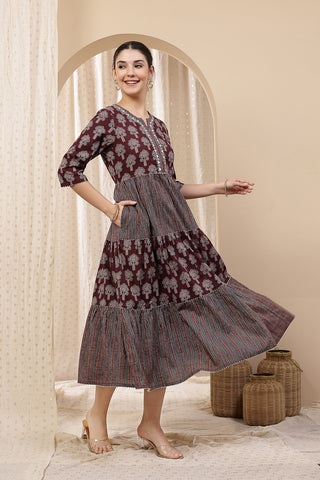Model posing, highlighting the accessible discreet nursing zips of the Ethnic Cotton Tiered Kurti for Feeding Kurti.