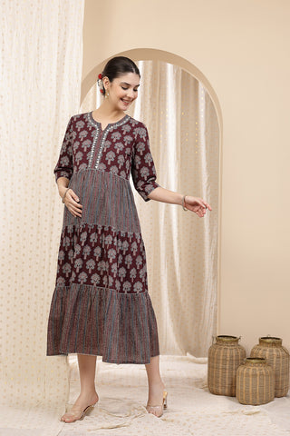 Model posing, highlighting the accessible discreet nursing zips of the Ethnic Cotton Tiered Kurti for Feeding Kurti.