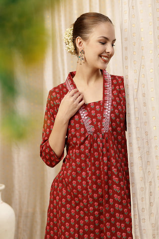 Model action shot of the Embroidered Floral Cotton Kurta Set, demonstrating ease of movement and fit.