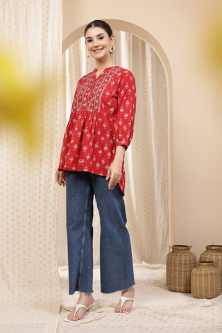 Close-up texture of Maternity Zipless Feeding Peplum Top - Rust in rust, showing the soft Cotton fabric.