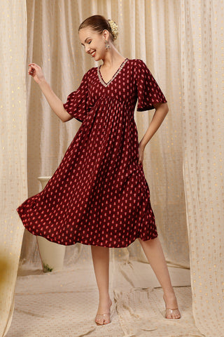 Woman wearing All Over Printed Concealed Zip Feeding Maternity Dress in Rust Brown - Pre & Post Pregnancy