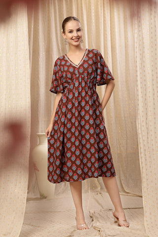 Woman wearing All Over Printed Concealed Zip Feeding Maternity Dress in Brown - Pre & Post Pregnancy