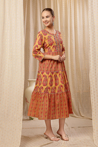 Model posing, highlighting the accessible discreet nursing zips of the Ethnic Cotton Tiered Kurti for Feeding Kurti.