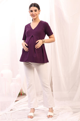 Detail shot of Cotton fabric; shows stretch and wine color/print.