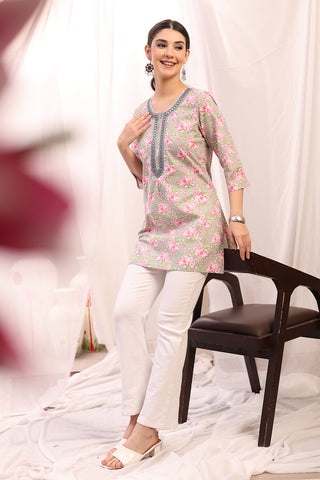 Detail shot of Rayon fabric; shows stretch and pink color/print.