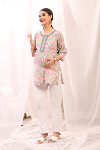 New mom wearing pink Maternity Tops; shows flattering post-delivery fit and Long Zip.