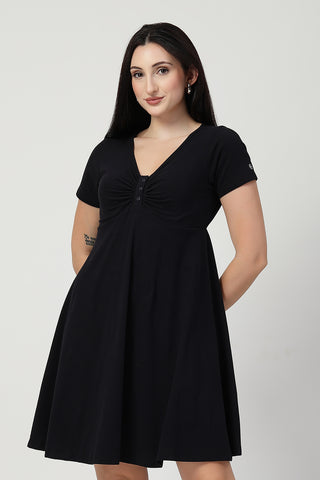 Woman wearing Ruched Cotton Zipless Feeding Dress in Black - Pre & Post Pregnancy