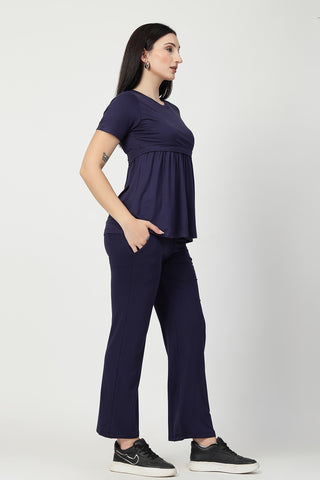 New mom wearing navy Maternity Tops; shows flattering post-delivery fit and Zipless.