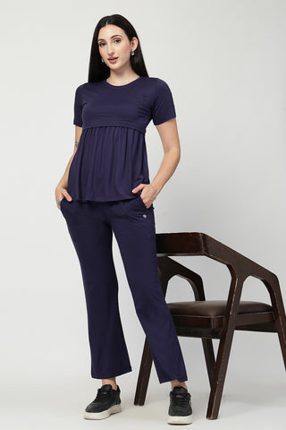 Styling detail of Navy Maternity Zipless Feeding Gathered Top, highlighting navy print and Maternity Tops design.