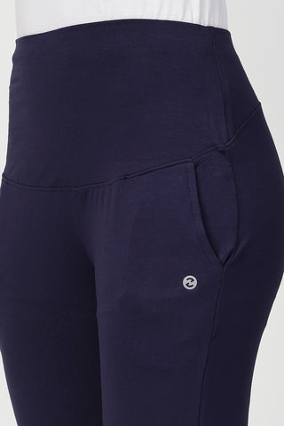 Model wearing Navy Pants; high waist band covers belly for full support.