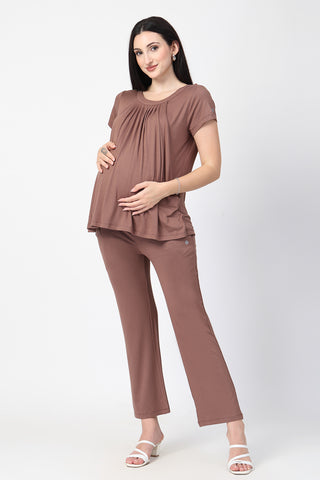 Detail shot of Viscose fabric; shows stretch and brown-milange color/print.