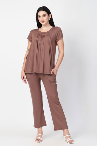 New mom wearing brown-milange Maternity Tops; shows flattering post-delivery fit and Zipless.