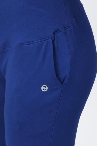 Model wearing Royal Blue Pants; high waist panel offers abdomen support during phases.