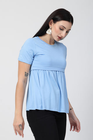 New mom wearing aqua-blue Maternity Tops; shows flattering post-delivery fit and Zipless.