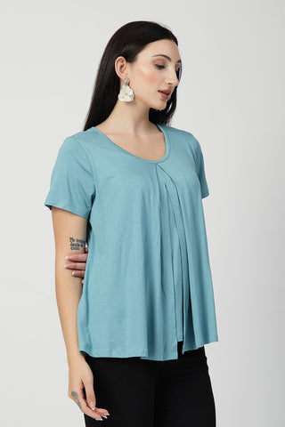 New mom wearing light-sea-green Maternity Tops; shows flattering post-delivery fit and Zipless.