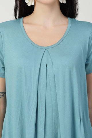 Smooth back view of light-sea-green Maternity Tops showing silhouette for comfort.