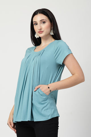 Styling detail of Sea Green Pleated Zipless Nursing Top, highlighting light-sea-green print and Maternity Tops design.