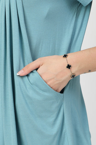 Smooth back view of light-sea-green Maternity Tops showing silhouette for comfort.