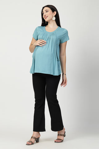 New mom wearing light-sea-green Maternity Tops; shows flattering post-delivery fit and Zipless.