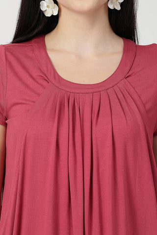 New mom wearing dusty-pink Maternity Tops; shows flattering post-delivery fit and Zipless.