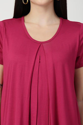 New mom wearing rosy-pink Maternity Tops; shows flattering post-delivery fit and Zipless.