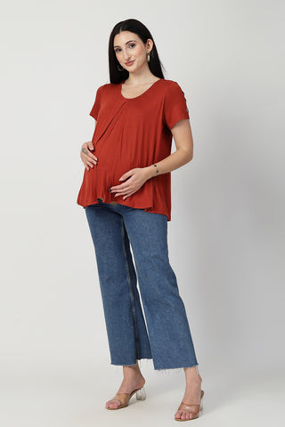 Detail shot of Viscose fabric; shows stretch and red color/print.