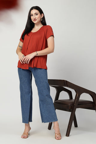 Close-up texture of Rust Front & Back Pleated Zipless Nursing Top in red, showing the soft Viscose fabric.