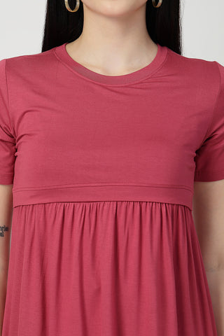 New mom wearing dusty-pink Maternity Tops; shows flattering post-delivery fit and Zipless.