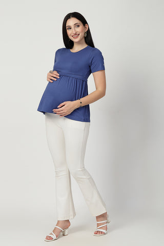 Detail shot of Viscose fabric; shows stretch and ditsy-blue color/print.