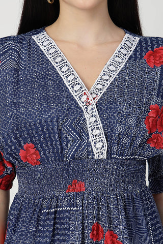 New mom wearing blue-with-floral-print Maternity Tops; shows flattering post-delivery fit and Zipless.