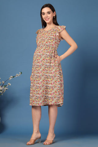 Woman wearing Ditsy Yellow Floral Bloom Zip Feeding Dress in Yellow - Pre & Post Pregnancy