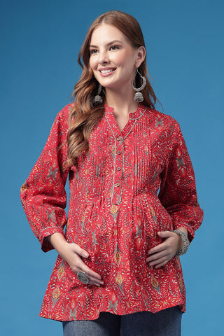 Red Top pleat detail; pleats add shape and comfort to the maternity top.