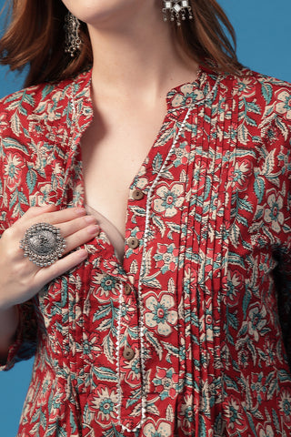 Model wearing Multi Pleated Top; garment provides coverage and fit for a changing body.