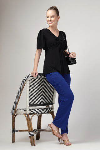 Detail shot of Viscose fabric; shows stretch and black color/print.