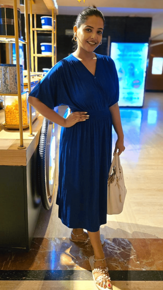 Blue Smocked Dress; waist gathers provide structure and adjustability.