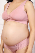 Model wearing Pink Padded Bra; cups provide a rounded lift and flattering silhouette.