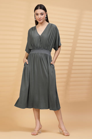 Woman wearing Charcoal Grey Solid Smocked Waist Zipless Feeding Dress in Grey - Pre & Post Pregnancy