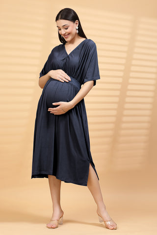 Woman wearing Navy Solid Smocked Waist Zipless Feeding Dress in Navy - Pre & Post Pregnancy