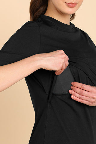 Model wearing Black Top; garment provides coverage and fit for a changing body.