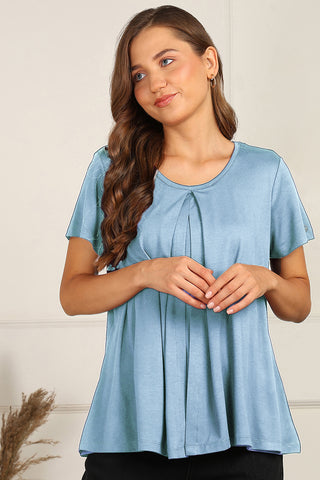 Model wearing Ice Blue Top; garment provides coverage and shape for a changing body.