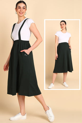 Model wearing Bottle Green Skirt; shoulder strap provides vertical support for the bump.